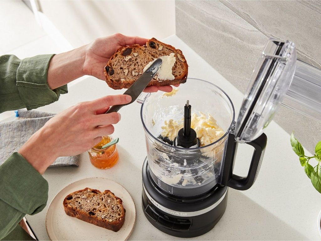 Food-processor-2.1L-onyx-black-woman-making-butter-in-processor.jpg